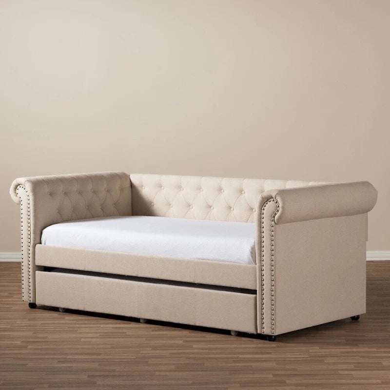 Lit de repos rembourré avec lit gigogne escamotable et garniture cloutée beige ou grise